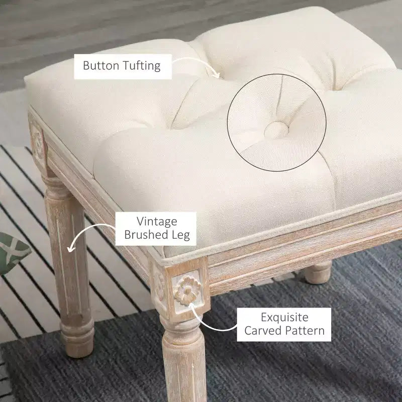 Ottoman carré beige avec assise capitonnée et pieds sculptés, simple
