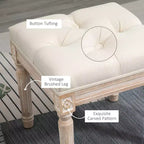 Ottoman carré beige avec assise capitonnée et pieds sculptés, simple