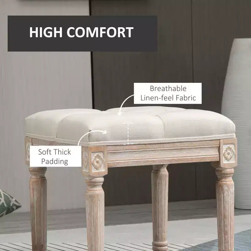 Ottoman carré beige avec assise capitonnée et pieds sculptés, simple